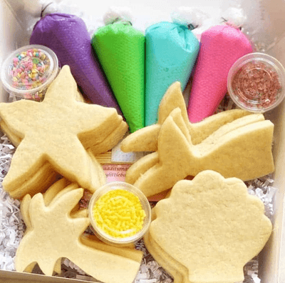 DIY cookie decorating kit with pre-baked cookies, icing bags and sprinkles